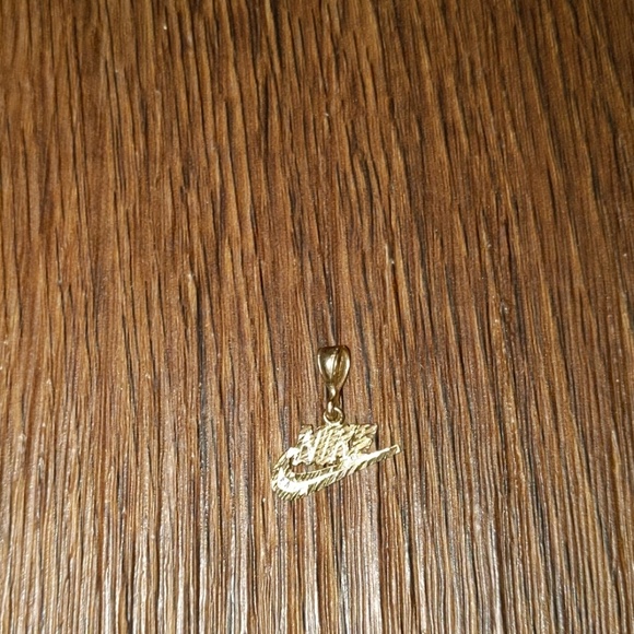 nike gold charm